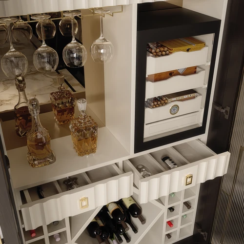 The Aldar wine cabinet has a structured design with drawers and bottle racks.
