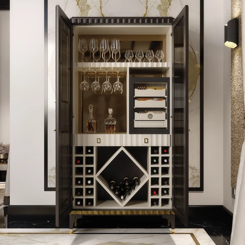 Several crystal wine glasses and bottles of wine in the Aldar wine cabinet